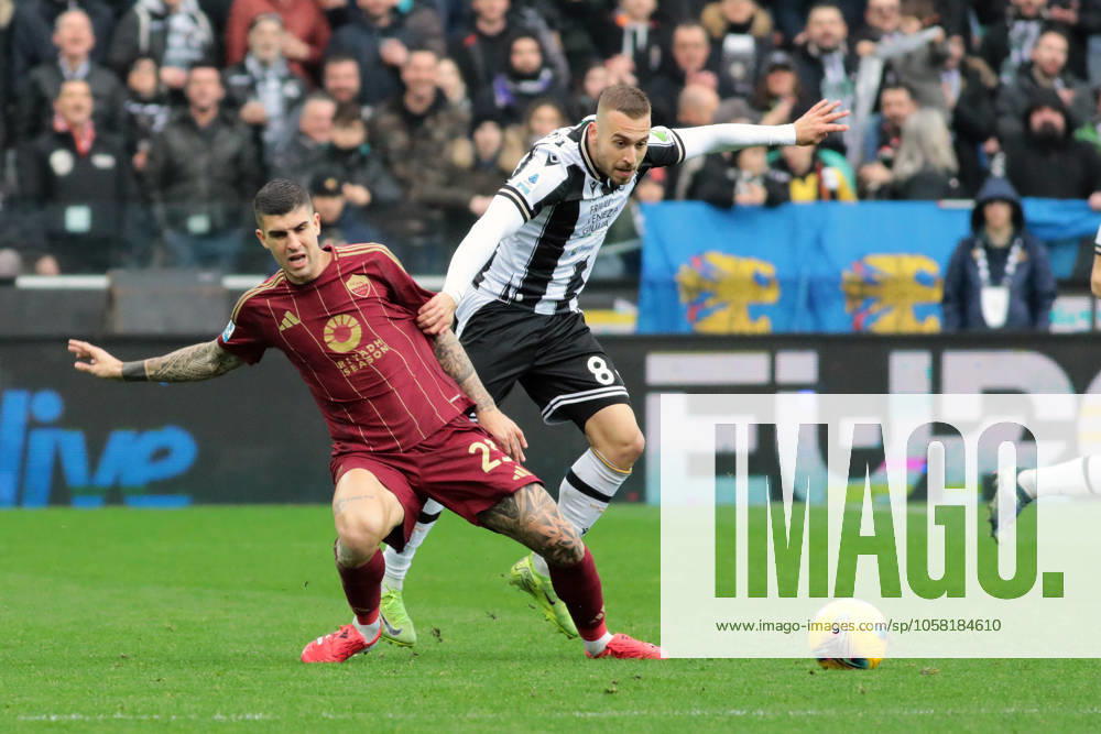 Roma s Gianluca Mancini fights for the ball with Udinese& x2019;s sandri lovric during the Serie A soccer match between Udinese and Roma at the Bluenergy Stadium in Udine, north east Italy - Sunday, January 26,2025 - soccer