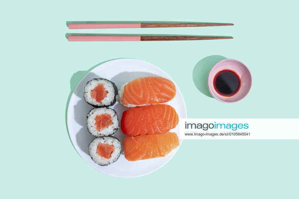 Studio shot of chopsticks, bowl of soy sauce and plate of maki sushi and nigiri GEMF04226