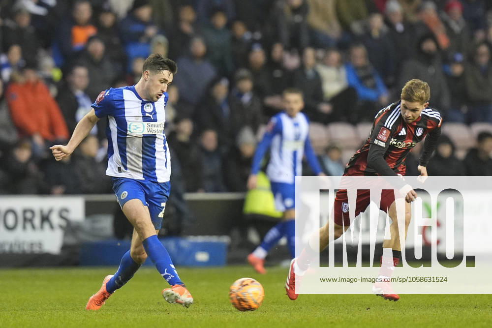 8th February 2025: Brick Community Stadium, Wigan, Greater Manchester, England; FA Cup Fourth Round Football, Wigan Athletic versus Fulham; James Carragher of Wigan Athletic passes the ball ActionPlus12748658 StevenxFlynn