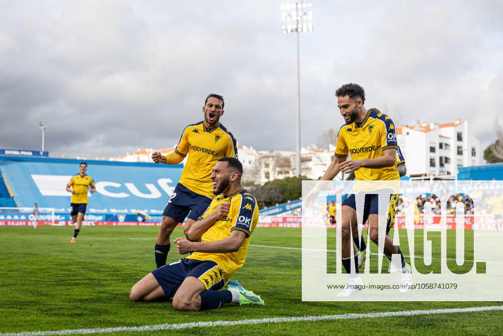 Yanis Begraoui of GD Estoril Praia celebrates with teammates; joao carvalho and rafik guitane after scoring a goal during the Liga Portugal Betclic match between Estoril Praia Futebol SAD and Boavista FC at Estadio Antonio Coimbra da Mota. Final score: Estoril Praia Futebol SAD 2 - 1 Boavista FC Cascais Portugal - ZUMAs197 20230130_aaa_s197_063