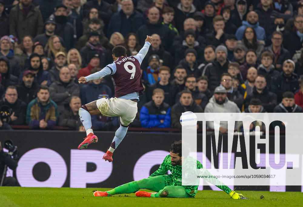 Football - FA Premier League - Aston Villa FC v Liverpool FC BIRMINGHAM, ENGLAND - Wednesday, February 19, 2025: Aston Villa s Marcus Rashford jumps over a challege fromLiverpool s goalkeeper Alisson Becker during the FA Premier League match between Aston Villa FC and Liverpool FC at Villa Park. (Photo by David Rawcliffe Propaganda) BIRMINGHAM Villa Park WEST MIDLANDS ENGLAND