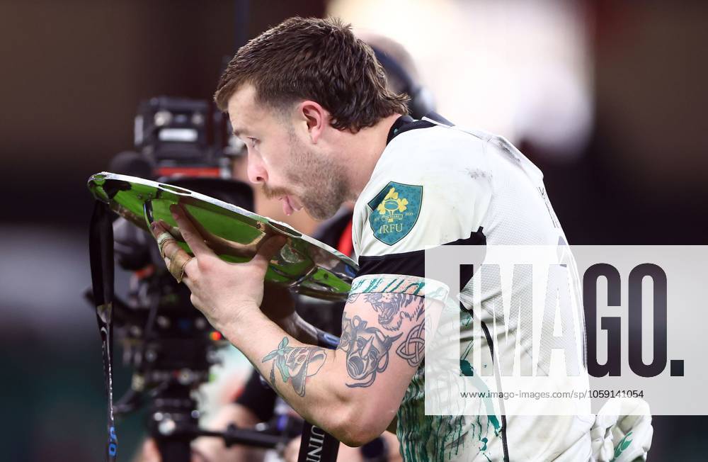 KW08 Mack Hansen of Ireland celebrates with the triple crown trophy at full time Wales v Ireland, Guinness Men s Six Nations Championship, Rugby Union, Principality Stadium, Cardiff, Wales, UK - 22 Feb 2025