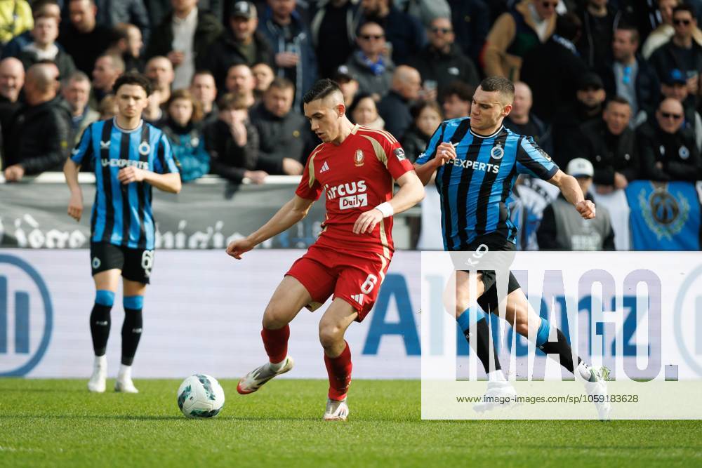 Standard s Sotiris Alexandropoulos and Club s Ferran Jutgla fight for the ball during a soccer match between Club Brugge and Standard de Liege, Sunday 23 February 2025 in Brugge, on day 27 of the 2024-2025 season of the Jupiler Pro League first division of the Belgian championship. KURTxDESPLENTER x113088598x