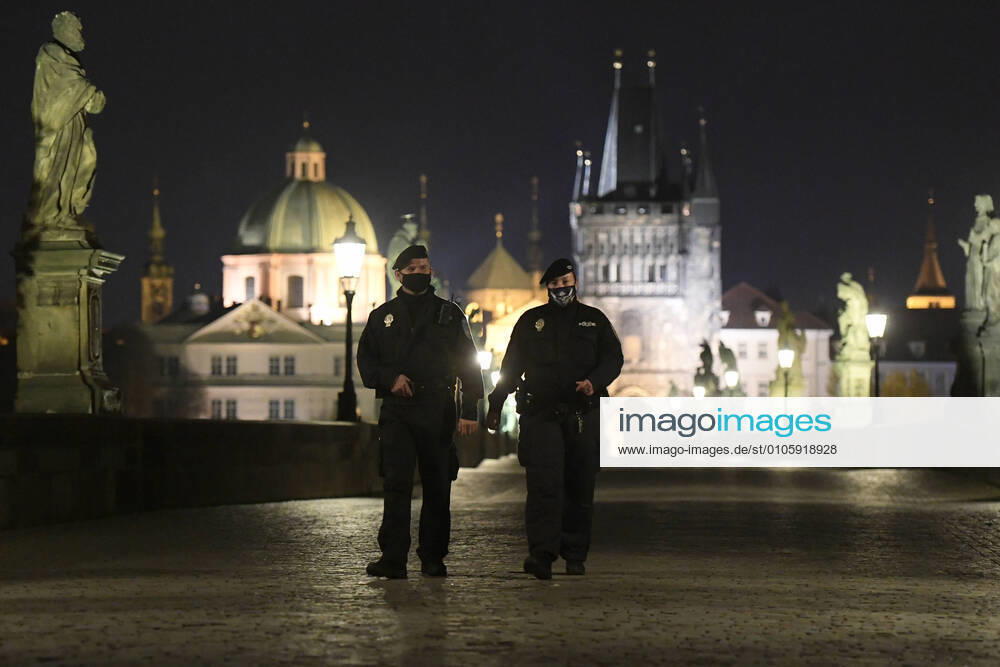Curfew in Czechia from 21:00 to 04:59. During the night, people may go to and from work, make urgent trips to a doctor and walk the dog outside, but only within up to a half-kilometre distance from their homes. People may also walk a dog outside, but not get more than half a kilometre from their home. Policemen at the city center of Prague, Czech Republic, October 28, 2020. (CTKxPhoto OndrejxDeml) CTKPhotoP202010281165401