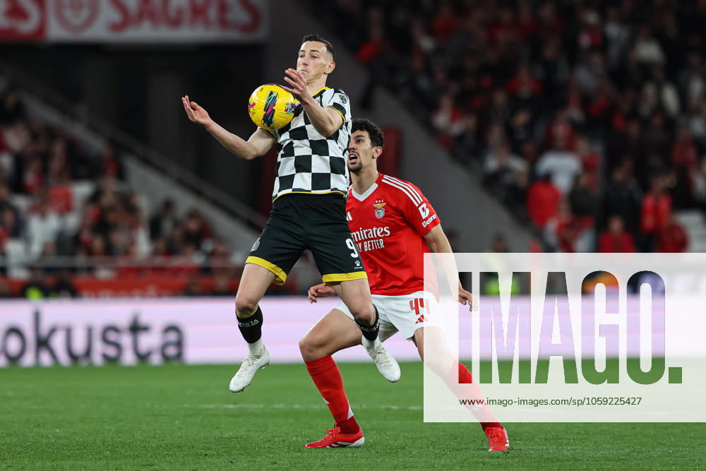 SL Benfica Vs Boavista FC in Lisbon, Portugal - 22 Feb 2025 (L-R) Robert Bozenik of Boavista FC with Tomas Araujo of SL Benfica in action during the Liga Portugal Betclic match between SL Benfica and Boavista FC at Estadio da Luz. (Final score: SL Benfica 3 - 0 Boavista FC) Lisbon Portugal