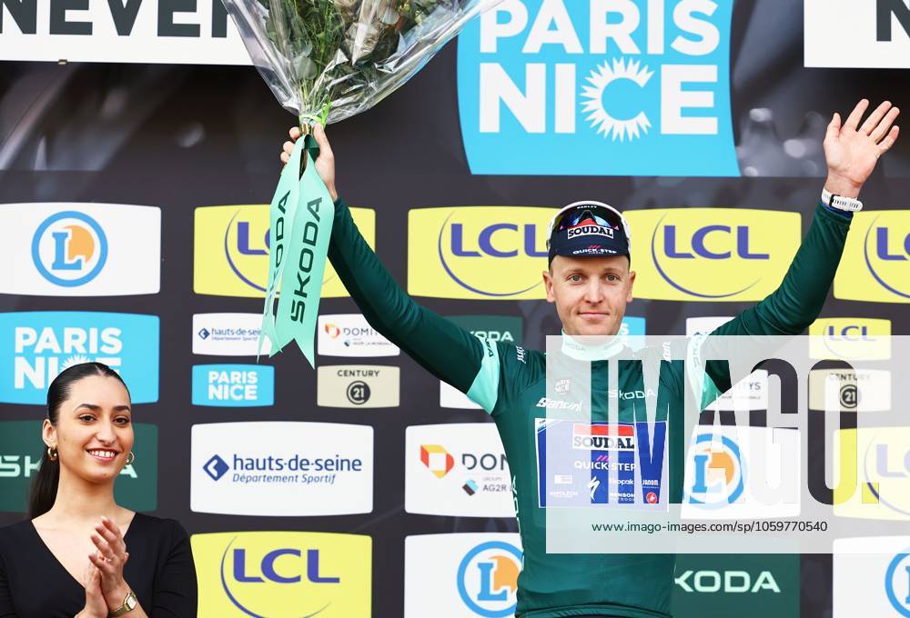 Belgian Tim Merlier of Soudal Quick-Step celebrates on the podium in the green jersey of leader in the sprint ranking after stage three of the 83th edition of the Paris-Nice cycling race, a 28,4km team time trial at the Nevers Magny-Cours racetrack, in Nevers, France, Tuesday 11 March 2025. DAVIDxPINTENS x114684909x