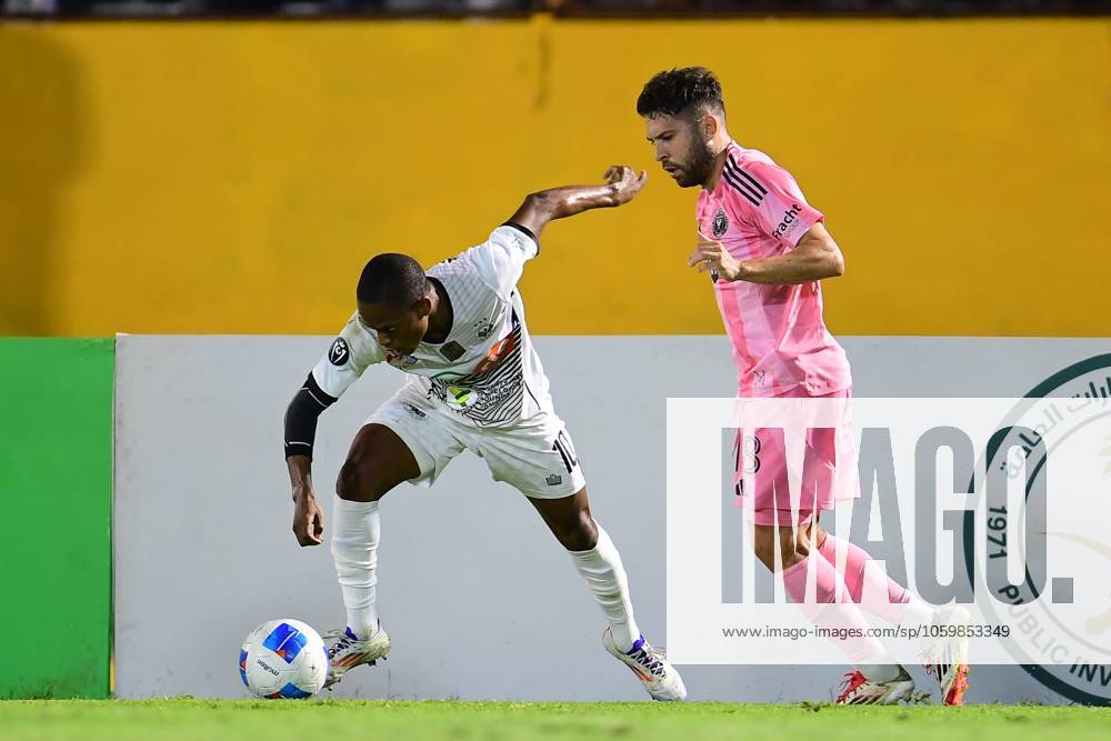 Concacaf Champions Cup 2025 Cavalier vs Inter Miami Dwayne Atkinson (L) of Cavalier fights for the. ball with Jordi Alba (R) of Inter Miami during the round of 16 second leg match between Cavalier and Inter Miami as part of the CONCACAF Champions Cup 2025, at National Stadium on March 13, 2025 in Kingston, Jamaica. KINGSTON JAMAICA JAMAICA