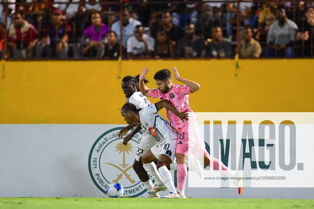 Concacaf Champions Cup 2025 Cavalier vs Inter Miami Dwayne Atkinson (L) of Cavalier fights for the ball with Jordi Alba (E) of Inter Miami during the round of 16 second leg match between Cavalier and Inter Miami as part of the CONCACAF Champions Cup 2025, at National Stadium on March 13, 2025 in Kingston, Jamaica. KINGSTON JAMAICA JAMAICA