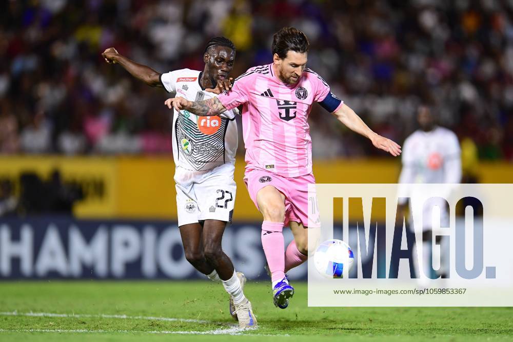 Concacaf Champions Cup 2025 Cavalier vs Inter Miami Jerome Mcleary (L) of Cavalier fights for the ball with Lionel Messi (R) of Inter Miami during the round of 16 second leg match between Cavalier and Inter Miami as part of the CONCACAF Champions Cup 2025, at National Stadium on March 13, 2025 in Kingston, Jamaica. KINGSTON JAMAICA JAMAICA