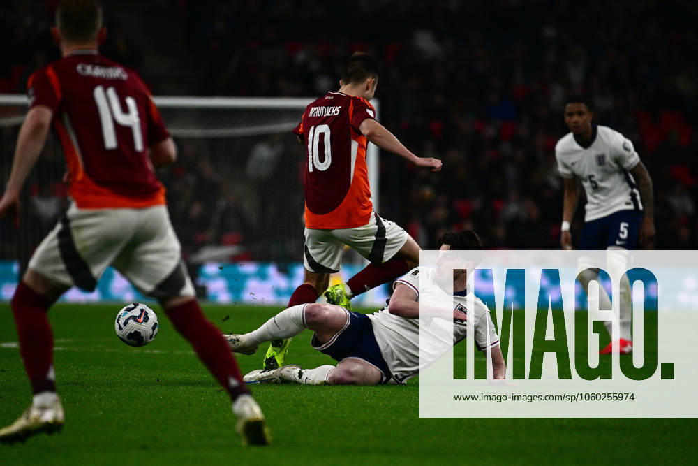 England v Latvia , London, UK - 24 Mar 2025 Declan Rice of England challenges for the ball with Janis Ikaunieks of Latvia during the FIFA World Cup, WM, Weltmeisterschaft, Fussball Qualifier match between England and Latvia on the 24th March 2025 at Wembley Stadium,, London on 24 Mar 2025 London Wembley Stadium London GBR