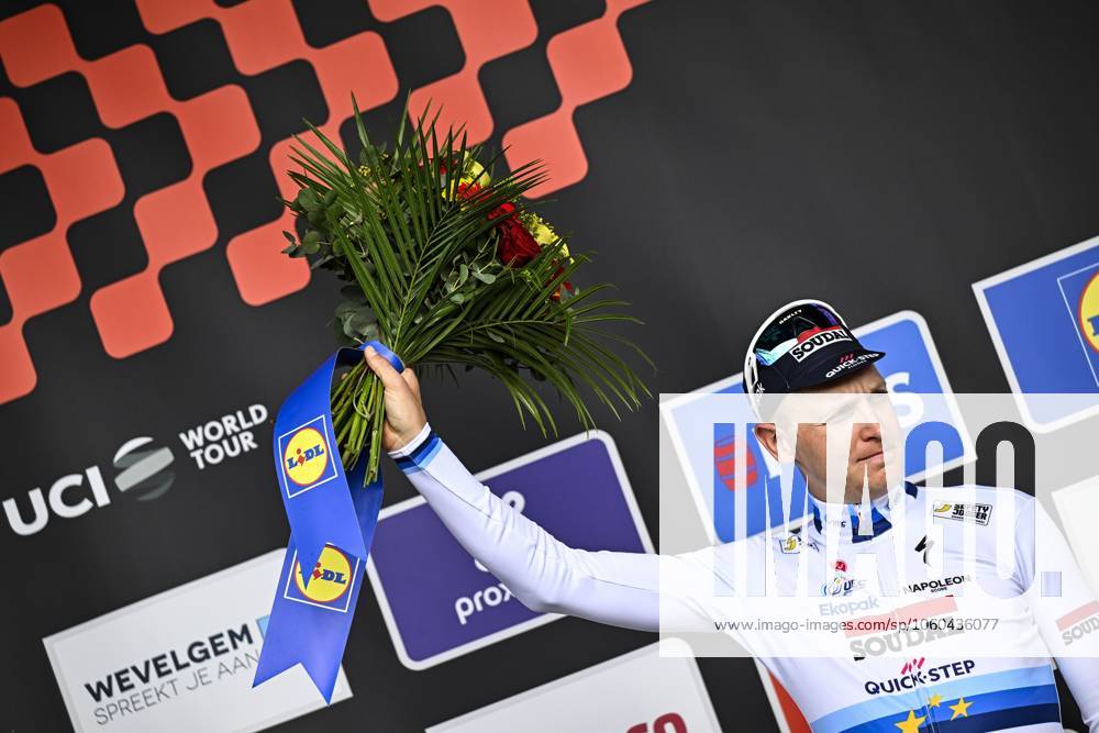 Belgian Tim Merlier of Soudal Quick-Step pictured on the podium after the men elite Gent-Wevelgem - In Flanders Fields one day cycling race, 250.3 km from Ieper to Wevelgem, Sunday 30 March 2025. JASPERxJACOBS x117245460x