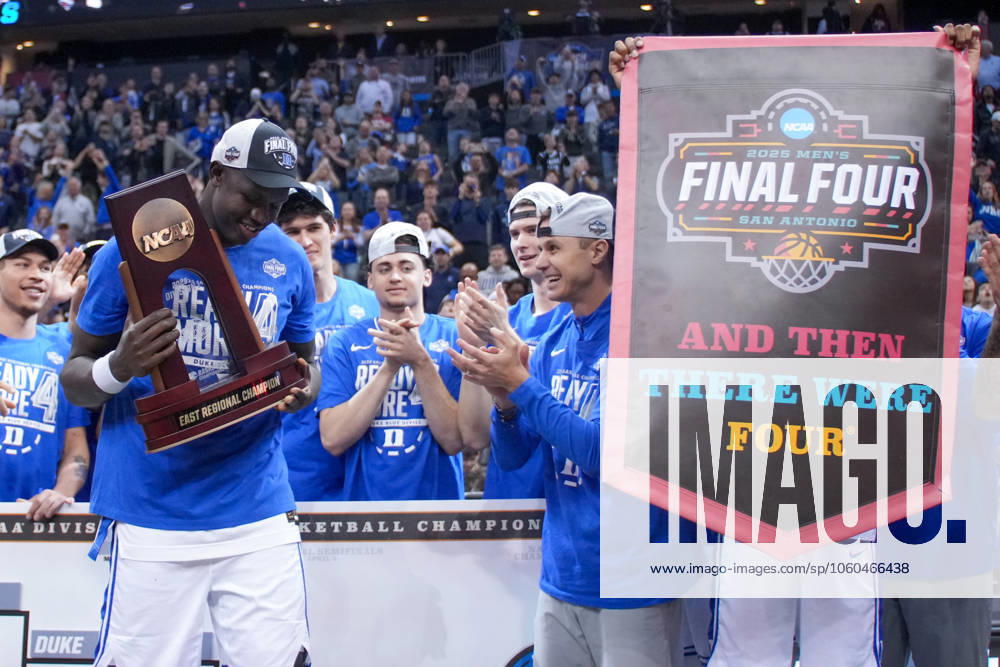 KHAMAN MALUACH ( 9) of the Duke Blue Devils celebrates with the East Regional trophy after Duke s Elite Eight win at the Prudential Center. Newark USA - ZUMA 20250329_mda_l223_068