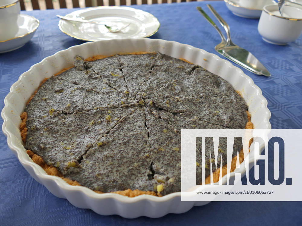 Poppy-seed cake according to grandmas recipe on a laid coffee table 1088812850