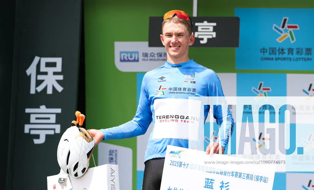 (250409) -- BAOTING, April 9, 2025 -- Vadim Pronskiy of Terengganu Cycling Team celebrates in the blue jersey during the awarding ceremony after Stage 3 at the 16th Tour of Hainan cycling race from Lingshui to Baoting, south China s Hainan Province, April 9, 2025. ) (SP)CHINA-HAINAN-BAOTING-CYCLING-TOUR OF HAINAN (CN) YangxGuanyu