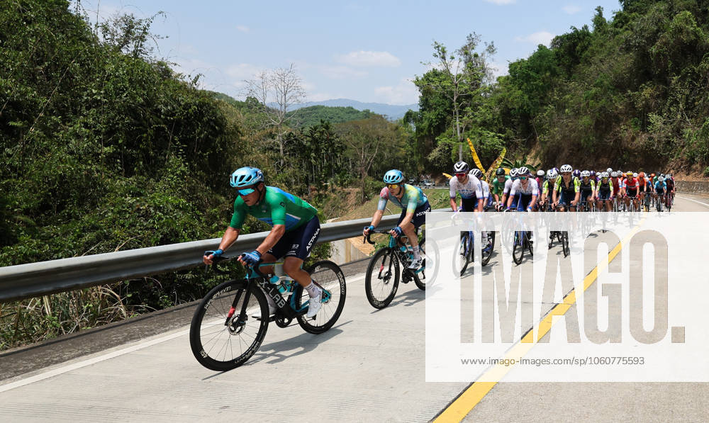 (250409) -- BAOTING, April 9, 2025 -- Cyclists compete during Stage 3 at the 16th Tour of Hainan cycling race from Lingshui to Baoting, south China s Hainan Province, April 9, 2025. ) (SP)CHINA-HAINAN-BAOTING-CYCLING-TOUR OF HAINAN (CN) YangxGuanyu