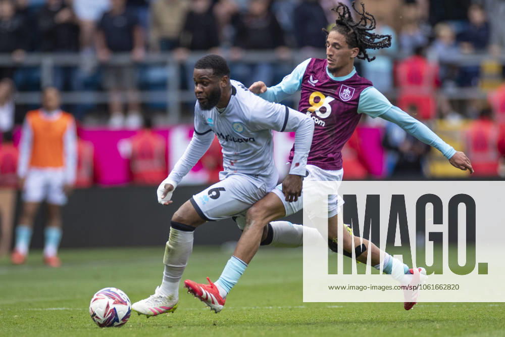 Burnley FC v Millwall FC - Sky Bet Championship Japhet Tanganga 6 of Millwall F.C. is challenged by Hannibal Mejbri 28 of Burnley FC during the Sky Bet Championship match between Burnley and Millwall at Turf Moor in Burnley, England, on May 3, 2025. Burnley Lancashire