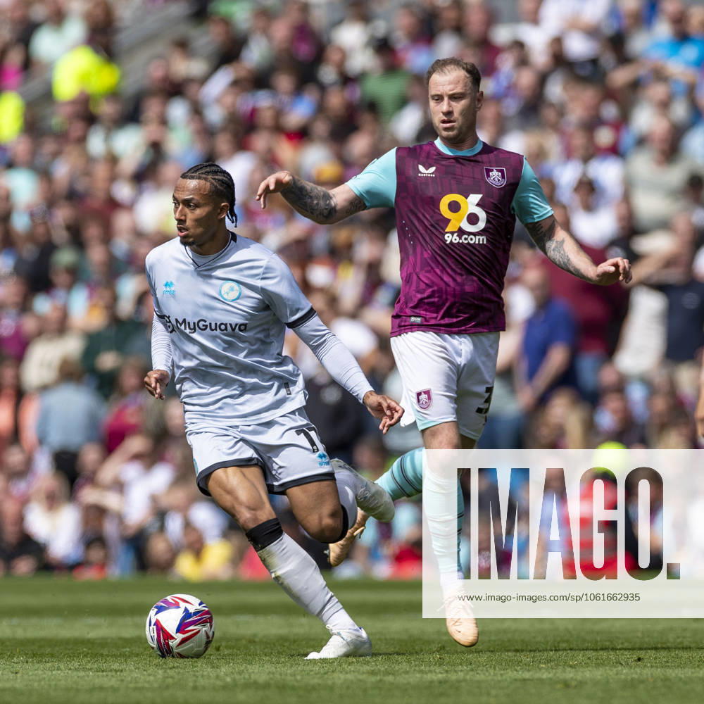 Burnley FC v Millwall FC - Sky Bet Championship Femi Azeez 11 of Millwall F.C. goes past Ashley Barnes 35 of Burnley FC during the Sky Bet Championship match between Burnley and Millwall at Turf Moor in Burnley, England, on May 3, 2025. Burnley Lancashire