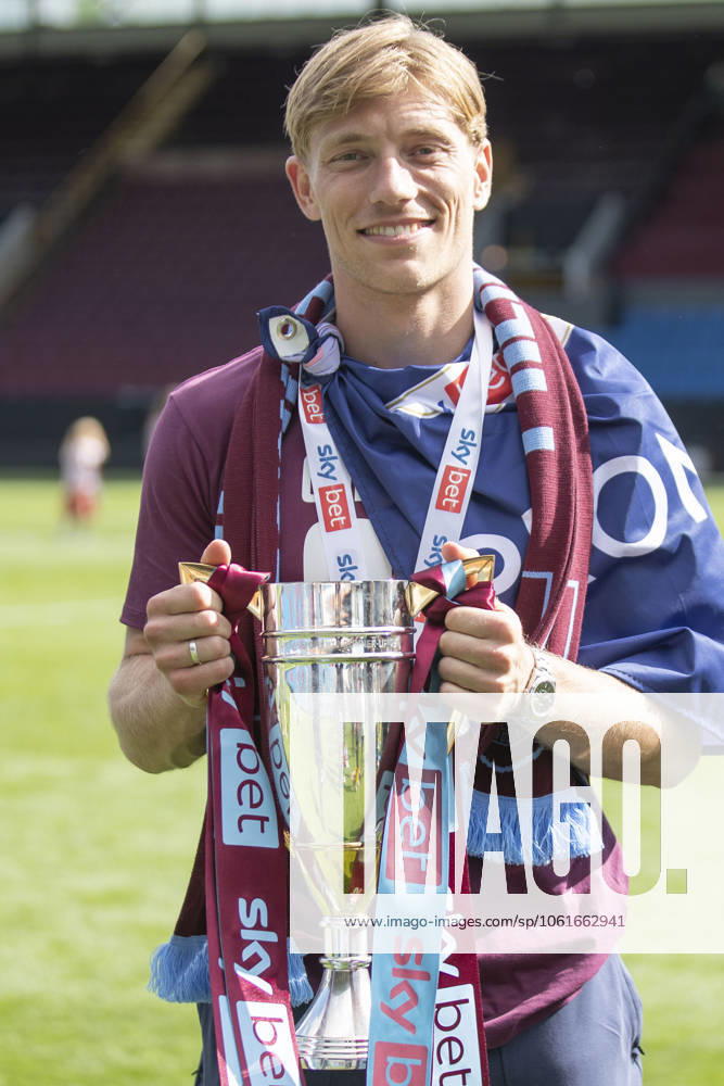 Burnley FC v Millwall FC - Sky Bet Championship Zian Flemming 19 of Burnley FC holds the Cup during the Sky Bet Championship match between Burnley and Millwall at Turf Moor in Burnley, on May 3, 2025. Burnley Lancashire