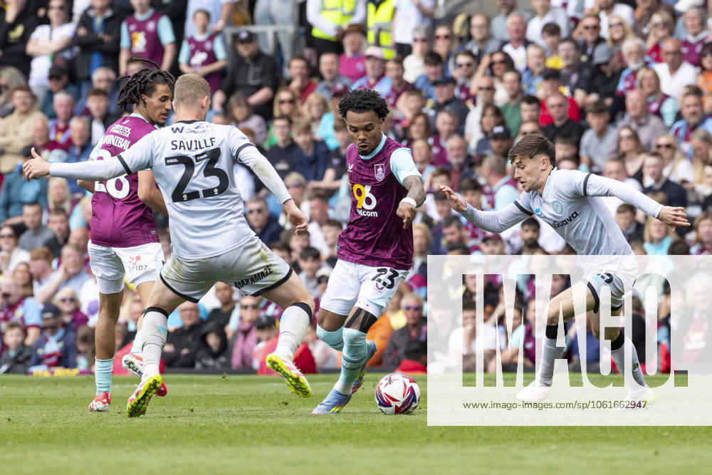 Burnley FC v Millwall FC - Sky Bet Championship Lucas Pires 23 of Burnley FC goes past Luke Cundle 25 of Millwall F.C. during the Sky Bet Championship match between Burnley and Millwall at Turf Moor in Burnley, on May 3, 2025. Burnley Lancashire