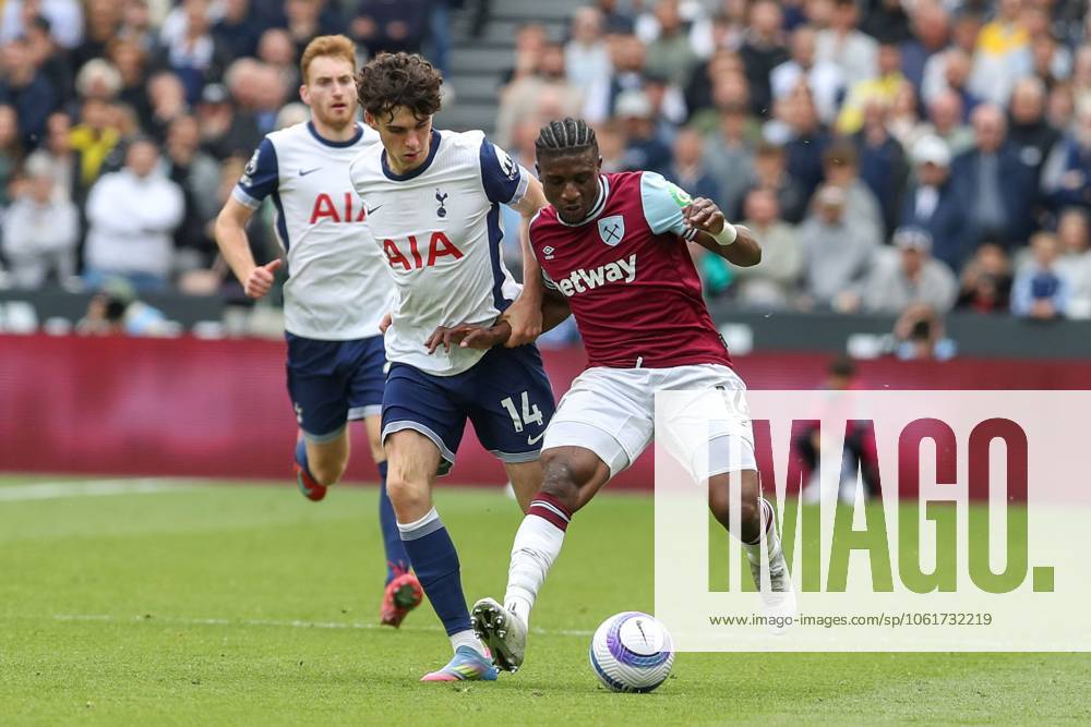 Mohammed Kudus of West Ham United in action with the ball with Archie Gray of Tottenham Hotspur closely behind West Ham United v Tottenham Hotspur, Football, Premier League, London Stadium, London, UK - 04 05 25 No use with unauthorised audio, video, data, fixture lists (outside the EU), club league logos or live services. Online in-match use limited to 45 images (+15 in extra time). No use to emulate moving images. No use in betting, games or