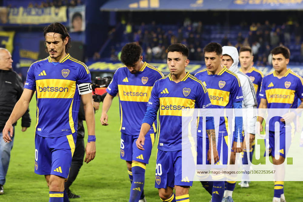 Boca Juniors Uruguayan forward Edinson Cavani L and players leave the pitch after losing the Argentine Professional Football League 2025 Apertura Tournament quarter final football match against Independiente, at La Bombonera stadium in Buenos Aires, on May 19, 2025 Independiente won by 0 1 and qualified to semi final match against Huracan BUENOS AIRES ARGENTINA