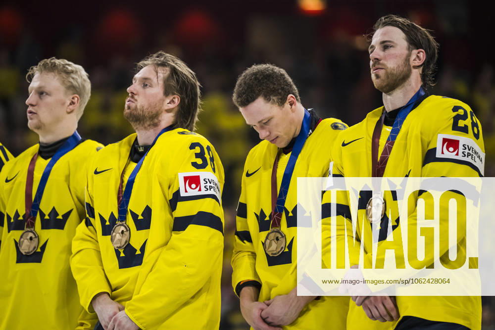 Rasmus Sandin, Lucas Raymond and Elias Lindholmof Sweden look dejected as the gather with their bronze medals during the national anthem after the 2025 IIHF Ice Hockey World Championship bronze medal game between Sweden and Denmark on May 25, 2025 in Stockholm Photo Maxim Thorà BILDBYRAN kod MT JM0696 bbeng ishockey ice hockey ishockey vm 2025 vm 2025 iihf world championship bronsmatch bronze medal game sverige sweden danmark denmark