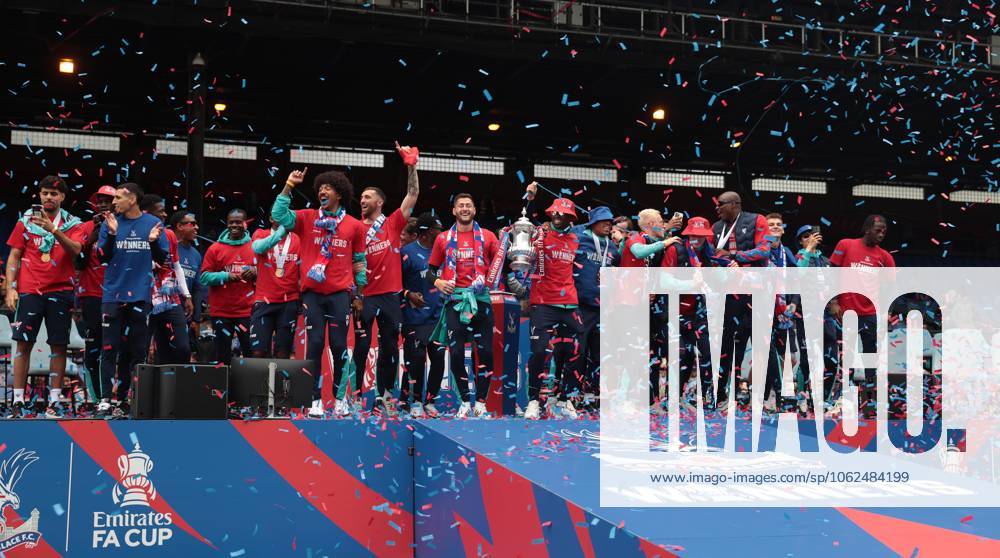 . - Crystal Palace FA Cup Trophy Parade & Celebrations, Selhurst Park Stadium, London, England. - 26th May 2025. (C) Daniel Weir Crystal Pix Joel Ward of Crystal Palace & Marc Guehi of Crystal Palace hold aloft the Emirates FA Cup Trophy in celebration with there team mates on the stage at Selhurst Park under Confetti during the Crystal Palace FA Cup trophy bus parade & party celebrations at Selhurst Park stadium in South London. - Crystal Palace FA Cup Trophy Parade & Celebrations, Selhurst Park Stadium, London, England. - 26th May 2025. (C) Daniel Weir Crystal Pix London Selhurst Park Stadium United Kingdom