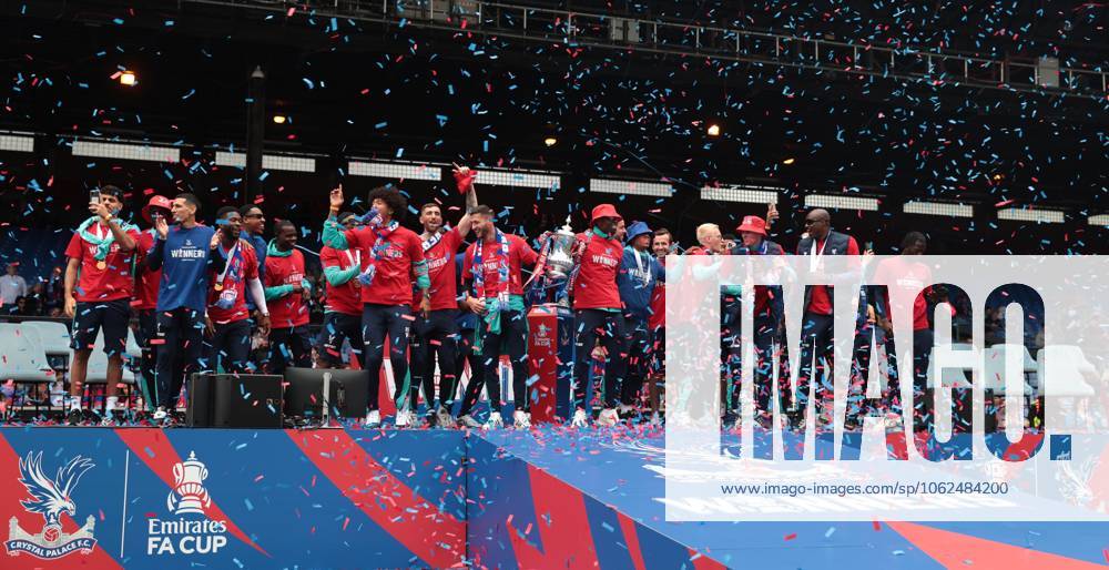 . - Crystal Palace FA Cup Trophy Parade & Celebrations, Selhurst Park Stadium, London, England. - 26th May 2025. (C) Daniel Weir Crystal Pix Joel Ward of Crystal Palace & Marc Guehi of Crystal Palace hold aloft the Emirates FA Cup Trophy in celebration with there team mates on the stage at Selhurst Park under Confetti during the Crystal Palace FA Cup trophy bus parade & party celebrations at Selhurst Park stadium in South London. - Crystal Palace FA Cup Trophy Parade & Celebrations, Selhurst Park Stadium, London, England. - 26th May 2025. (C) Daniel Weir Crystal Pix London Selhurst Park Stadium United Kingdom