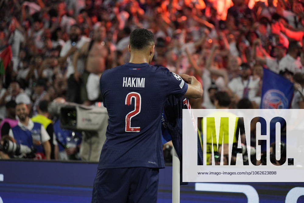2025 UEFA Champions League Final: Paris Saint-Germain F.C. vs. FC Internazionale Milano Desire Doue of Paris Saint-Germain F.C. scores his second goal of the evening and celebrates, as his teammate Achraf Hakimi of Paris Saint-Germain F.C. puts his shirt on the corner flag during the 2025 UEFA Champions League Final: Paris Saint-Germain F.C. vs. FC Internazionale Milano on 31 May 2025, at Munich Football Arena, in Munich, Germany Munich Munich Football Arena Germany