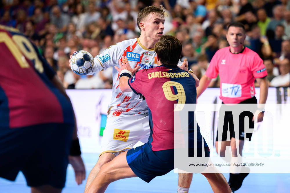 Cologne, Germany Handball EHF CL Final 4 semi-final Barca SC Magdeburg from left in duel Gisli Thorgeir Kristjansson SC Magdeburg , Jonathan Carlsbogard Barcelona Cologne Lanxess Arena Nordrhein Westfalen Germany