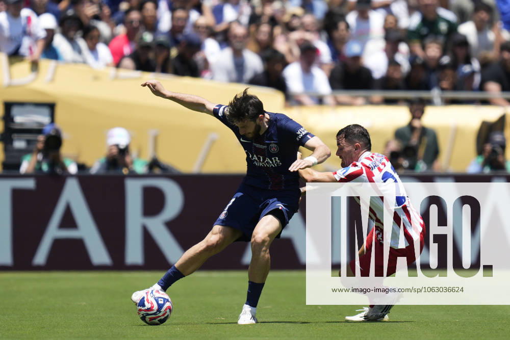 Paris Saint-Germain FC v Club Atletico de Madrid: Group B - FIFA Club World Cup 2025 PASADENA, CALIFORNIA - JUNE 15: Khvicha Kvaratskhelia left winger of PSG and Georgia and Javi Galan left-back of Atletico de Madrid and Spain compete for the ball during the FIFA Club World Cup 2025 group B match between Paris Saint-Germain FC and Club Atletico de Madrid at Rose Bowl Stadium on June 15, 2025 in Pasadena, California. Jose Hernandez Anadolu California United States. Editorial use only. Please get in touch for any other usage.