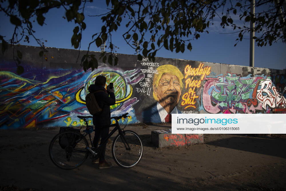 Graffiti by artist Eme Freethinker with picture of US President Donald Trump and writing Goodbye Piece of Shit in Mauerpark in Berlin on November 12, 2020 Donald Trump Graffiti in Berlin