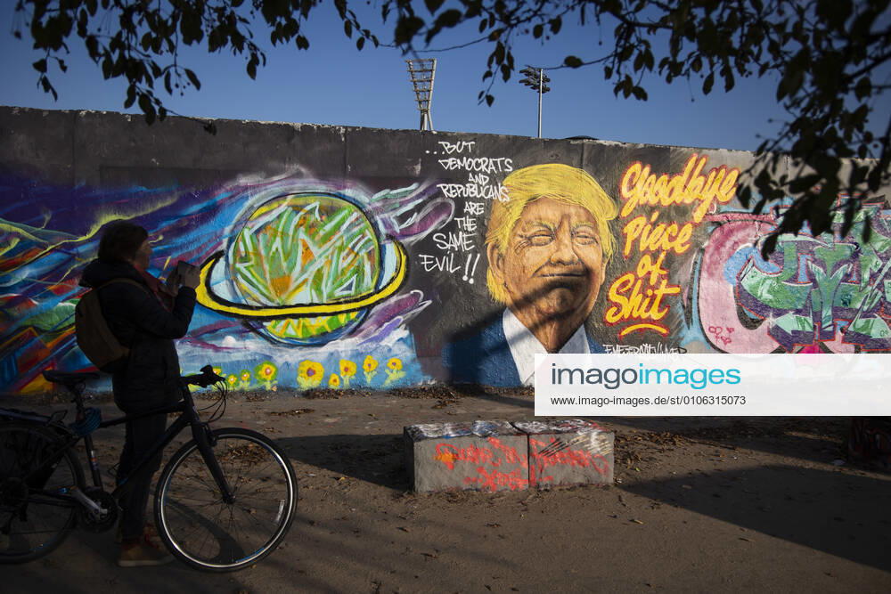 Graffiti by artist Eme Freethinker with picture of US President Donald Trump and writing Goodbye Piece of Shit in Mauerpark in Berlin on November 12, 2020 Donald Trump Graffiti in Berlin