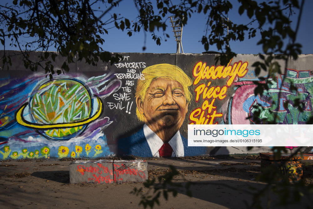 Graffiti by artist Eme Freethinker with picture of US President Donald Trump and writing Goodbye Piece of Shit in Mauerpark in Berlin on November 12, 2020 Donald Trump Graffiti in Berlin
