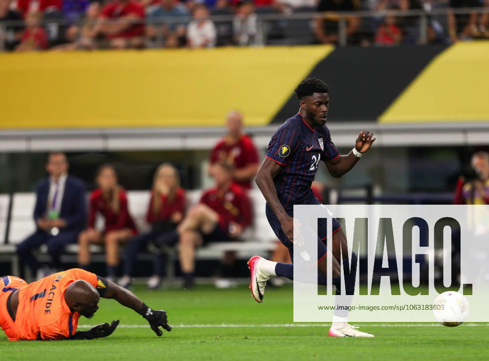Team USAâ€⠢s PATRICK AGYEMANG (24) passes Haiti goalkeeper JOHNY PLACIDE (10) in front of the Team USA goal during their Concacaf Gold Cup match at AT&T Stadium in Arlington on Saturday. Arlington USA - ZUMAm257 20250622_zsp_m257_004