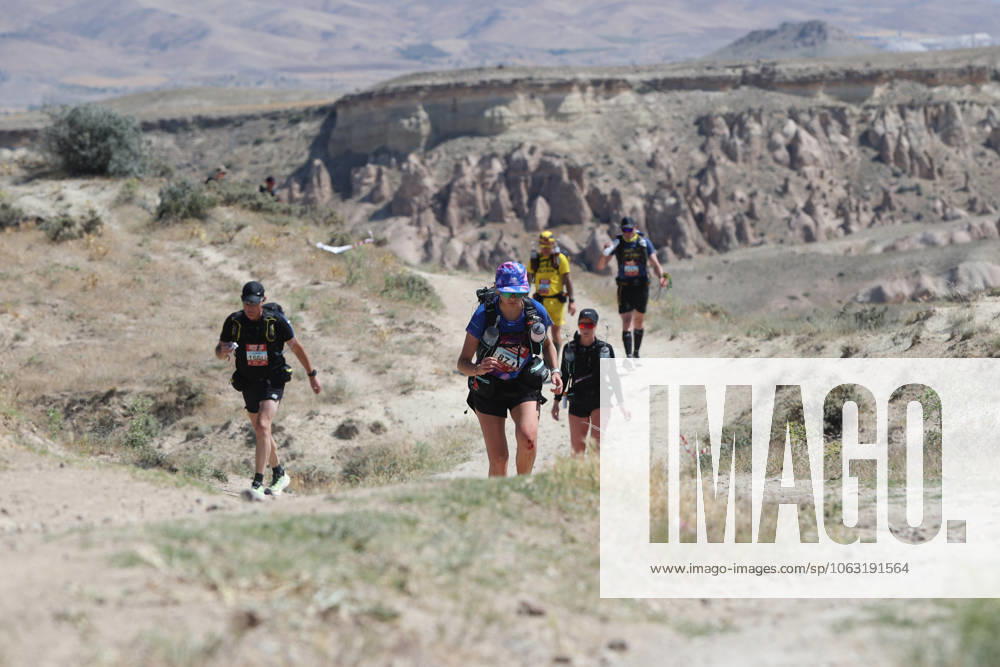 KW26 Cappadocia Desert Marathon kicks off in Turkiye s Nevsehir NEVSEHIR, TURKIYE - JUNE 23: Runners compete during the Cappadocia Desert Marathon which was held in the Urgup district of Nevsehir, Turkiye on 23, 2025. The marathon, which was organized with the participation of 350 athletes from 25 countries, took place on a 25-kilometer track. The marathon started in Pancarlik Valley, passed through the fairy chimneys, Devrent and Aktepe locations and near Goreme Open Air Museum, and ended in Kiliclar Valley. Behcet Alkan Anadolu Nevsehir Turkey. Editorial use only. Please get in touch for any other usage.