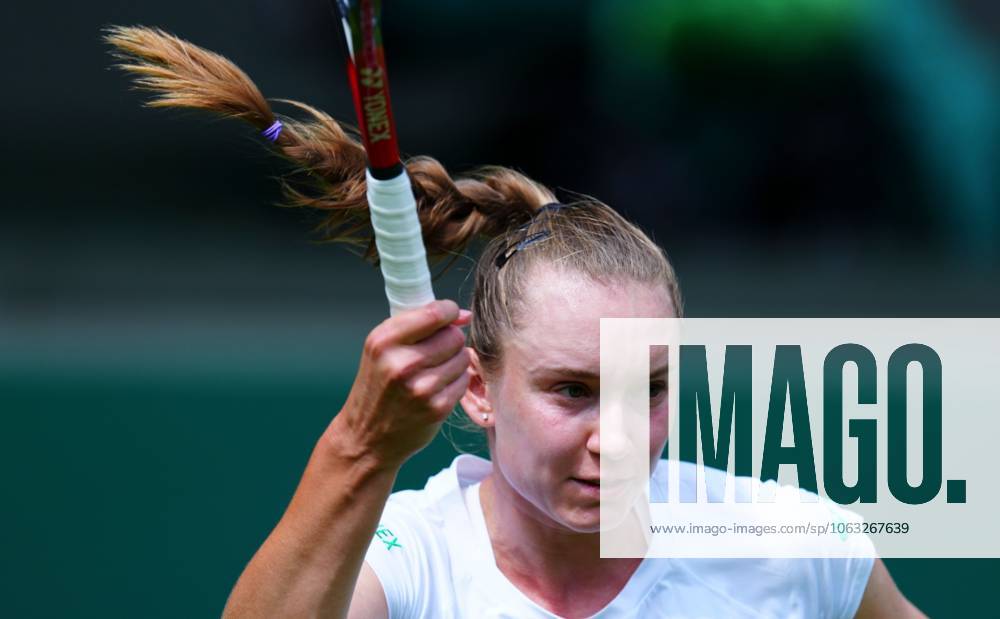Elena Rybakina practices, momentarily without her trademark visor, with Emma Raducanu Wimbledon Tennis Championships, Friday Practice, The All England Lawn Tennis and Croquet Club, London, UK - 27 Jun 2025London The All England Lawn Tennis and United Kingdom