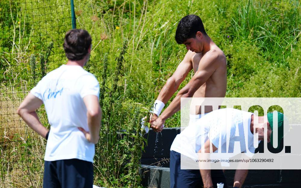 Carlos Alcaraz wrings out his shirt after practice Wimbledon Tennis Championships, Saturday Practice, The All England Lawn Tennis and Croquet Club, London, UK - 28 Jun 2025London The All England Lawn Tennis and United Kingdom