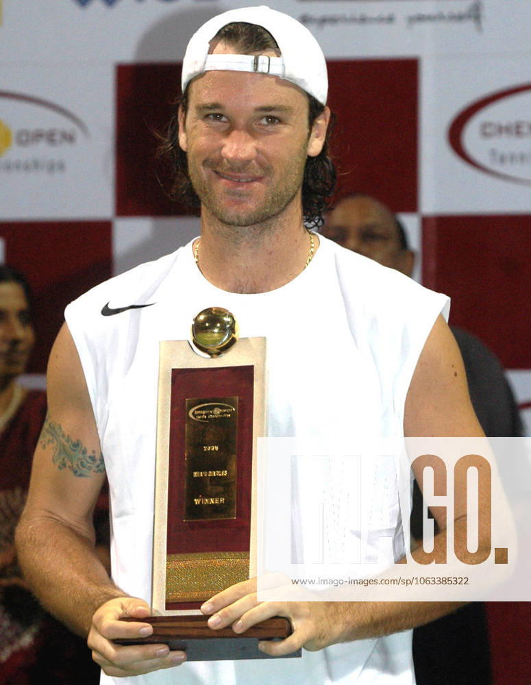Jan 09, 2005; Madras, INDIA; CARLOS MOYA of Spain holds his trophy after winning the ATP, Tennis Herren Tour Chennai Open tennis championship at the south Indian city of Madras on January 09, 2005. The world number five tennis player beated Thai star Paradorn Srichaphan 3-6, 6-4, 7-6 (7-5) in the final match. Moya donated his entire 8,770 prize money to relief efforts for the December 26 tsunami-earthquake catastrophe that killed more than 150,000 in Asia. Madras INDIA