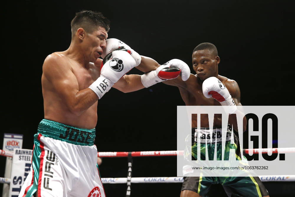 Liverpool, England, United Kingdom - ZOLANI TETE connects a punch to JOSE SANTOS GONZALEZ during IBF International Bantamweight Title bout at Liverpool Echo Arena.