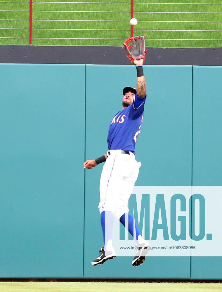 Arlington, TX, USA - Texas Rangers center fielder Ian Desmond catches a fly ball hit by the Los Angeles Angels Rafael Ortega in the first inning at Globe Life Park in Arlington, Texas, on Friday, April 29, 2016. The Rangers won, 4-2.