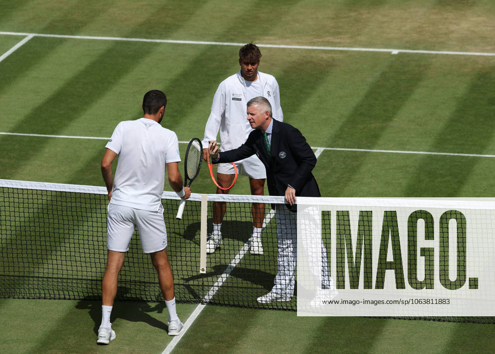7th July 2025; All England Lawn Tennis and Croquet Club, London, England; Wimbledon Tennis Tournament, Day 8; Umpire shows the coin to Marin Cilic (CRO) and Flavio Cobolli (ITA) ActionPlus12811150 JohnxPatrickxFletcher