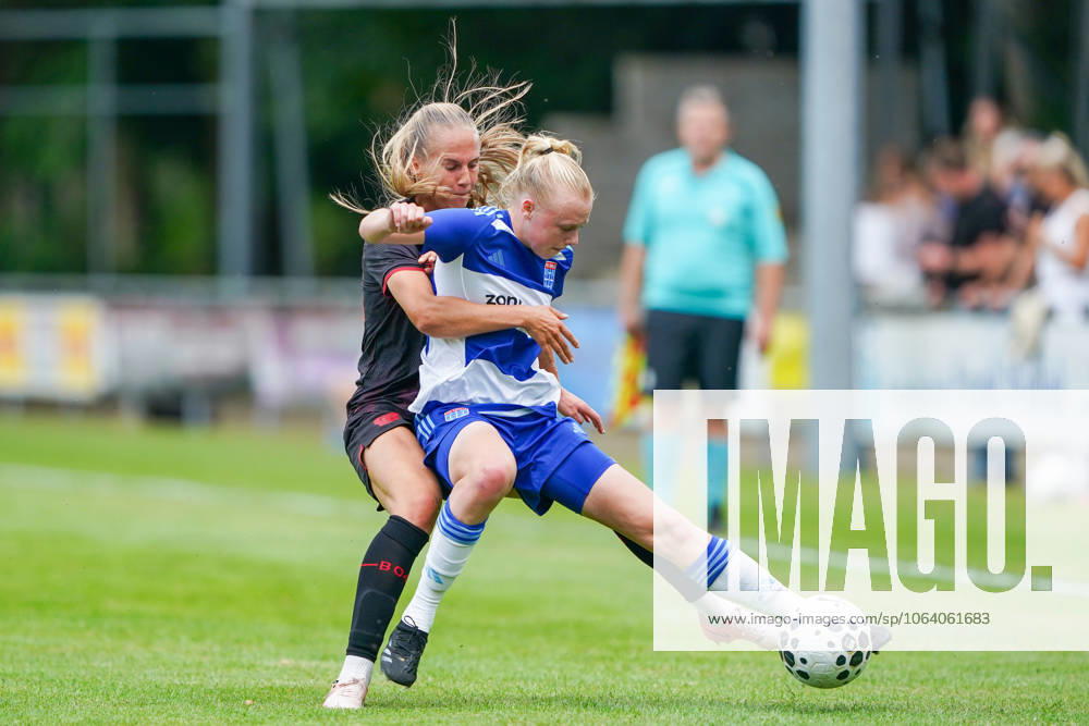 2025-07-11 PEC Zwolle Women v Bayer Leverkusen Women - Pre-season friendly WEZEP, NETHERLANDS - JULY 11: Juliette Vidal of Bayer Leverkusen 04, Lyanne Iedema of PEC Zwolle during the Pre-season friendly match between PEC Zwolle Women and Bayer Leverkusen Women at Sportpark Mulderssingel on July 11, 2025 in Wezep, Netherlands. Wezep Sportpark Mulderssingel Netherlands Content not available for redistribution in The Netherlands directly or indirectly through any third parties.