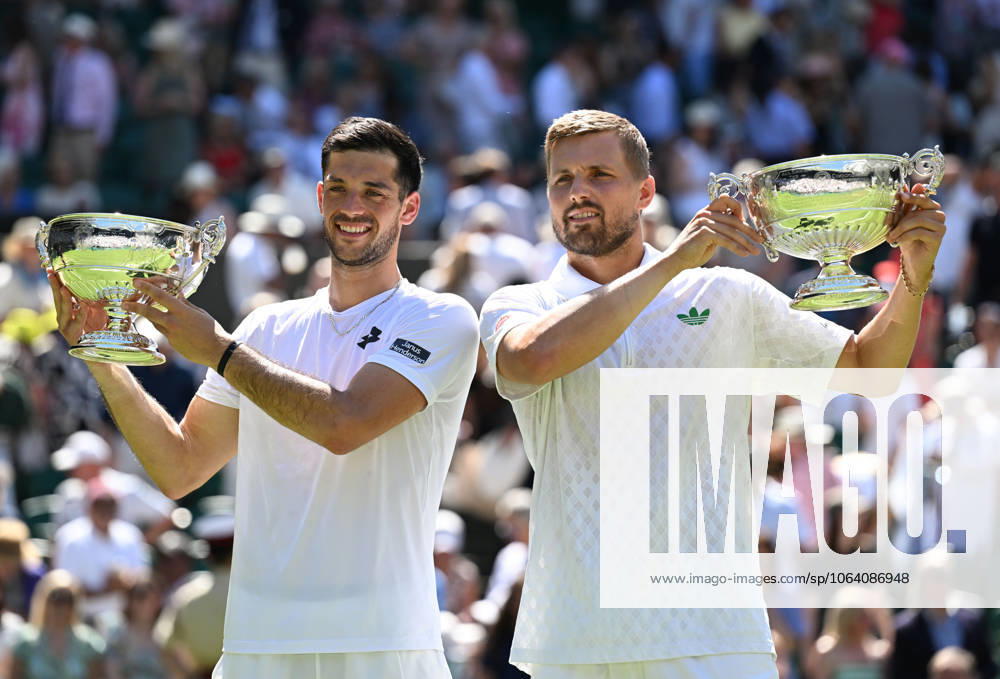 (250712) -- LONDON, July 12, 2025 -- Julian Cash (L) Lloyd Glasspool pose with their trophies during the awarding ceremony after the men s doubles final between Rinky Hijikata (Australia) David Pel (the Netherlands) and Julian Cash Lloyd Glasspool of Britain at the Wimbledon Tennis Championships in London, Britain, July 12, 2025. ) (SP)BRITAIN-LONDON-TENNIS-WIMBLEDON-MEN S DOUBLES-FINAL ZhaoxDingzhe