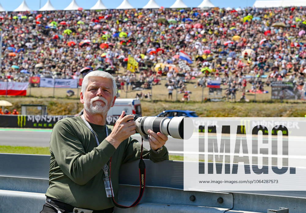 The Grand Prix of the Czech Republic, Moto3 category World Championship, WM, Weltmeisterschaft race, in Brno, Czech Republic, on July 20, 2025. Czech President Petr Pavel photographs the race. (CTKxPhoto VaclavxSalek) CTKPhotoP2025072002419 CTKPhotoP2025072002419