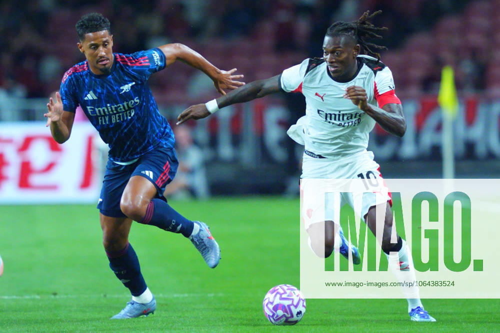 Arsenal FC V AC Milan - Pre-Season Friendly Match Rafael Leao of AC Milan dribbles past William Saliba of Arsenal during the pre-season friendly match between Arsenal FC and AC Milan at National Stadium in Singapore on July 23, 2025. Singapore Singapore