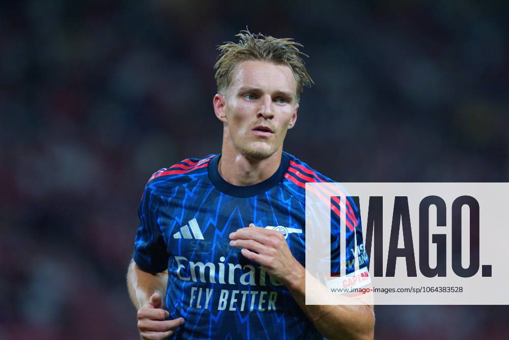 Arsenal FC V AC Milan - Pre-Season Friendly Match Martin Odegaard of Arsenal is in action during the pre-season friendly match between Arsenal FC and AC Milan at National Stadium in Singapore on July 23, 2025. Singapore Singapore