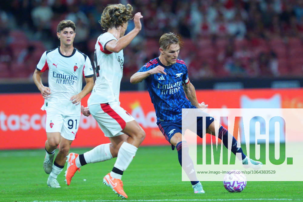 Arsenal FC V AC Milan - Pre-Season Friendly Match Martin Odegaard of Arsenal controls the ball during the pre-season friendly match between Arsenal FC and AC Milan at National Stadium in Singapore on July 23, 2025. Singapore Singapore