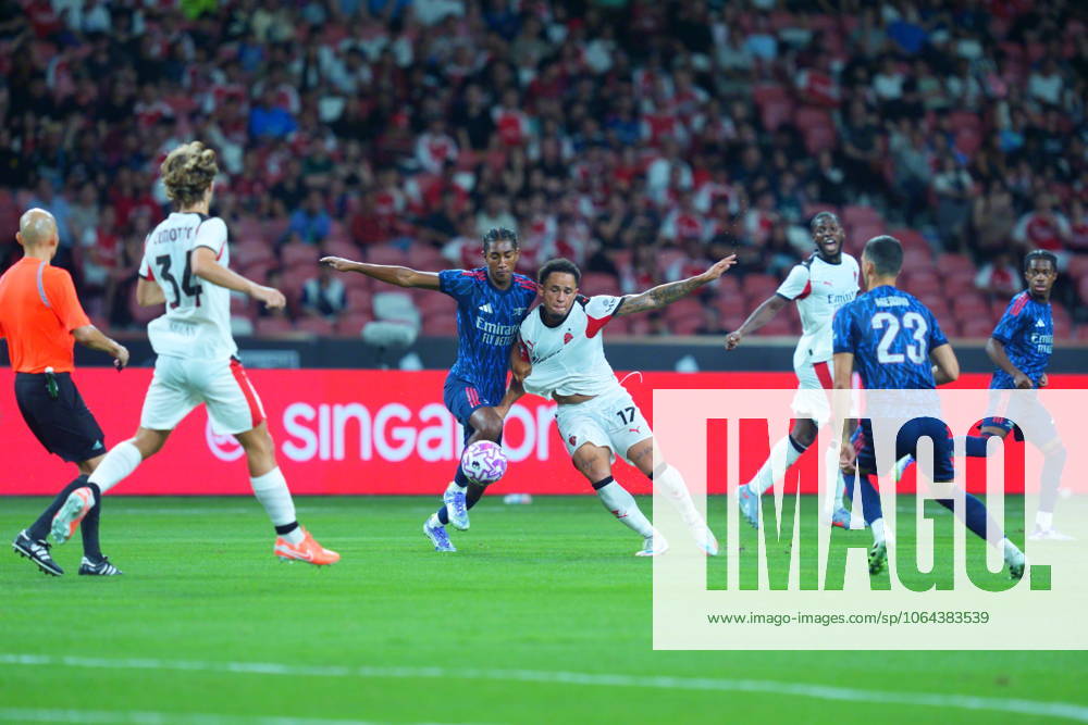 Arsenal FC V AC Milan - Pre-Season Friendly Match Noah Okafor of AC Milan and Marli Salmon of Arsenal challenge for the ball during the pre-season friendly match between Arsenal FC and AC Milan at National Stadium in Singapore on July 23, 2025. Singapore Singapore