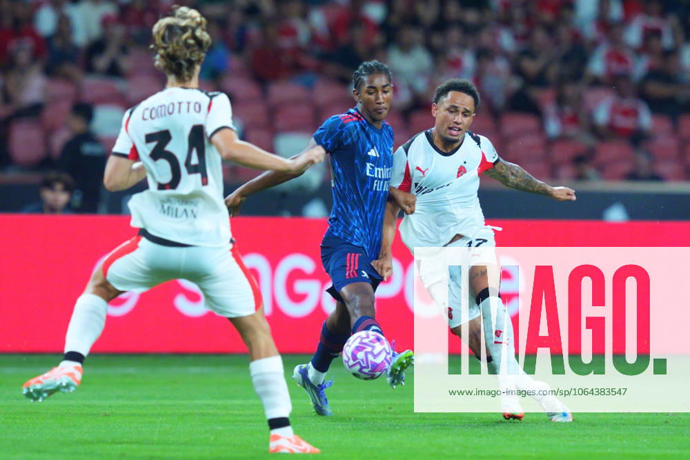 Arsenal FC V AC Milan - Pre-Season Friendly Match Noah Okafor of AC Milan and Marli Salmon of Arsenal challenge for the ball during the pre-season friendly match between Arsenal FC and AC Milan at National Stadium in Singapore on July 23, 2025. Singapore Singapore
